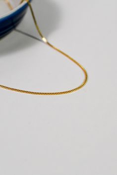 Secure your style with this bold Mixed Metal Safety Pin Lock Necklace featuring a safety pin lock in 24k gold plated CZ over brass, and a medium CZ pendant in 24k gold filled. Detachable charm holder and long 21" 24k gold filled double rolo chain add a sense of movement to this daring piece. Complete with a silver CZ carabiner lock and 4-leaf petal charm in 24k gold filled, this necklace is ready for whatever adventure you take on next! Mixed Metal Safety Pin Lock Necklace17.5" mixed metal 4mm c Yellow Gold Plated Box Chain Necklace, Yellow Gold-plated Box Chain Necklace, Yellow Gold Plated Charm Necklace With Box Chain, Yellow Gold-plated Charm Necklace With Box Chain, Everyday Gold-tone Box Chain Necklace, Classic Gold Box Chain Necklace, Everyday Gold-tone Necklace With Box Chain, Yellow Gold Pendant Necklace With Box Chain, Dainty Gold Charm Necklace With Box Chain