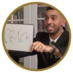 a man in a suit holding up a sign with the word trick written on it