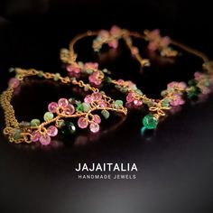 Let yourself be enchanted by the "Wild Roses" set, where craftsmanship meets the magic of nature. Each piece in this exclusive set is handcrafted, ensuring a unique and personal touch. Necklace: A wearable work of art, this necklace is a tribute to the delicate beauty of wild roses. The intertwined 14K gold strands form a flowering branch, embellished with pink stones and sparkling topaz. Raw emerald leaves of different sizes add a touch of vibrant green, while small faceted garnet buds complete the design. A thin gold chain blends harmoniously with the whole, and the 925 silver clasp guarantees elegance and security. The extension, adorned with an emerald crystal briolette, gives a refined and unique finish. Bracelet: At the center, a branch finely crafted in gold is intertwined with roug Elegant Wire-wrapped Tourmaline Jewelry, Elegant Wire Wrapped Tourmaline Jewelry, Elegant Tourmaline Wire Wrapped Jewelry, Gold Whimsical Jewelry With Unique Variations, Handmade Pink Nature-inspired Jewelry, Handmade Tourmaline Bohemian Jewelry, Whimsical Handmade Gold Jewelry, Gold Hand Wrapped Nature-inspired Jewelry, Gold Tourmaline Jewelry For Weddings