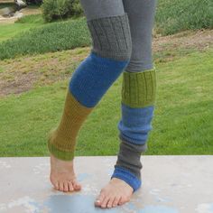 These hand knit over the knee/thigh high leg warmers will soon be your favorite.  Wear them over tights, with your shorts or under track pants.  They are long enough to pull over the knee, or you can slouch  them down over your cold feet.  Perfect accessory for the cold fall and winter months.    Wear them to your yoga, Pilates or ballet class.   Hand knit from a warm and cozy yarn of 80% acrylic and 20% wool in color blocks of blue, gray, gold and green.  Color placement varies in each pair.  T Fitted Knitted Knee-high Legwear, Stretch Green Leg Warmers For Fall, Fitted Green Leg Warmers For Fall, Casual Fitted Knitted Leg Warmers, Casual Knitted Legwear, Casual Fitted Knitted Legwear, Fitted Knit Footless Leg Warmers, Fitted Thigh High Knitted Legwear, Fitted Thigh-high Knitted Legwear