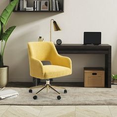 a yellow office chair sitting in front of a desk with a laptop computer on it