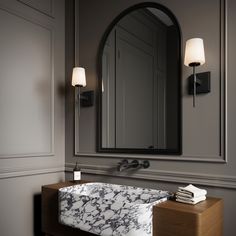 The Blake Vanity Collection references a classic silhouette paired with a modern, sleek finish in distinctive matte black. Versatile and stylish, this transitional wall sconce makes a wonderful addition to your primary bathroom vanity and adds sophistication to your powder room. Featuring a slim arm mounted to a square backplate, supporting a beautiful frosted glass shade, this 16” tall wall light provides soft illumination for your room. The Blake is also available in a coordinating 24" 3 light Master Bath With Black Vanity, Bathrooms With Sconces, Bathrooms With Black Vanities, Primary Bathroom Vanity, Vanity Sconces Bathroom, Black Bathroom Sconces, White Traditional Bathrooms, Bathroom Mirror Light, Bathroom Light Sconces