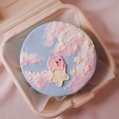 there is a cake in the shape of a pink pig on top of clouds and stars