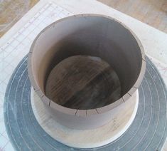 a wooden bowl sitting on top of a table