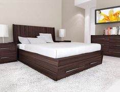 a bed room with a neatly made bed and two night stands