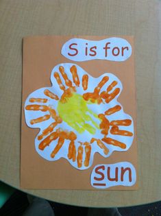 a child's handprint on a piece of paper that says, sis for sun