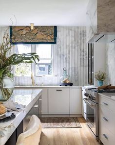 a kitchen filled with lots of counter top space next to a stove top oven and microwave