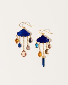 Grainne Morton Cloud and Rain Drops Earrings in Lapis. Playful cloud earrings made with made with lapis, cameo, abalone, fine opal, mystic coated quartz, amethyst, and vintage rhinestone, set in 18k gold plated silver. Hook ear fitting. Handmade in Edinburgh, Scotland. Dimensions: 2.36" long, 1" wide Material: 18K gold plated silver Origin: Scotland Why we Covet: Cult of smallness. Hand Made Earings, Funky Clay Earrings, Fun Earrings Unique, Eccentric Earrings, Handmade Earrings Ideas, Eclectic Earrings, Mystical Outfits, Interesting Earrings, Grainne Morton