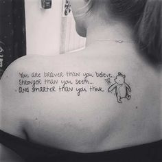 a woman with a tattoo on her back saying you are brave upon your bedtime