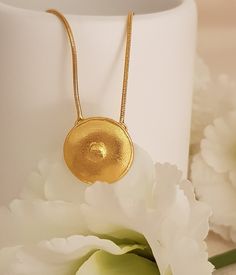 18K gold plated Circle pendant necklace This simple design is perfect for every day, layered or worn alone. Lovely as a bridesmaids gift or as wedding jewelry! Each necklace will arrive in a black gift box. Spring clasp closure on 2 mm chain Pendant Diameter: 20 mm The gold plating is a high quality 3 microns 18k gold thick Weight: 5.2 Gram Model is shown with 18 -inch chain Select chain length at checkout SKU TP0114 This Necklace has Matching earrings: https://www.etsy.com/listing/668383363/ Cu Wedding Pendant Charm Necklaces, Tarnish Resistant, Tarnish Resistant Brass Wedding Necklace, Delicate Brass Necklace For Wedding, Delicate Brass Wedding Necklace, Gold Plated Pendant Charm Necklaces For Wedding, Gold Plated Pendant Charm Necklace For Wedding, Plated Round Pendant Necklace For Gift, Gold Charm Necklace For Wedding, Tarnish Resistant, Recycled Gold Necklace With Large Pendant As Gift