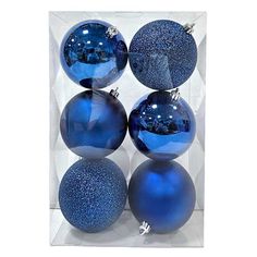 four blue christmas ornaments in a clear box