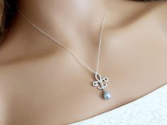 Fleur-De-Lis Cubic Zirconia Light Blue Pearl Silver Bridal Pendant Necklace with .925 Sterling Silver Chain. PLEASE READ ITEM DESCRIPTION and SHOP POLICIES before placing your order, and contact me with any questions! CHAIN is 18 inches (45.7cm) long. PENDANT is 1.29 inch (3.3cm) long. BRIDAL NECKLACES SECTION: https://www.etsy.com/shop/LanaChayka?ref=seller-platform-mcnav§ion_id=11638944 NECKLACES SECTION: https://www.etsy.com/shop/LanaChayka?ref=seller-platform-mcnav§ion_id=17026331 Elegant an Elegant Light Blue Necklace For Wedding, Elegant Light Blue Wedding Necklaces, Delicate Blue Necklace For Wedding, Elegant Light Blue Jewelry For Wedding, Elegant Blue Wedding Necklaces, Elegant Blue Wedding Necklace, Bridal Pendant Necklace, Bridal Necklaces, Lily Blue