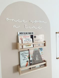 there is a book shelf with books on it and the words once upon a time above it