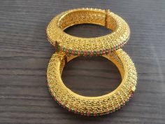 Indian gold kada  Bangles indian pakistani wedding jewelry in gold plating are beautiful, elegent & will surely galvanize you, because our products are unique, comfortable, fashion forward & very popular for the rich look.  *High quality craftsmanship 100% satisfaction guarantee  *Plated in  Gold plating *openable kada bangles  *Bangles kada size 2.4 *base metal for is copper  *package include pair of gold kada bangles *ready to ship from Houston TX United States GIFT- It comes in gift box perfect for gifting to your mom , sister, in laws, friends, on there birthday, wedding , bridal shower, anniversary, festival , and many more... Discover a variety of Necklace sets and Earring  only at Azzashiny.fj . our product are made from metal & alloys like Copper or Brass respectively. Azzashinyfj Gold Kada Bangles, Pakistani Wedding Jewelry, Kada Bangles, Gold Kada, Jewelry Pakistani, Copper Gifts, Bangle Gold, Bangles Indian, Pakistani Jewelry