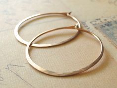 Rose gold hoop earring, a modern classic.Hammered hoops out  18 guage, 14K rose gold filled wire - a staple for any wardrobe. Shiny and organic, each one a little unique from the other since they've been formed and hammered by hand.Measures just under 1 1/2" in diameter. Gold Hoop Earring, Rose Gold Hoop Earrings, Earrings Rose Gold, Beating Heart, Heavy Metals, Santa Baby, Large Earrings, Rose Earrings, Disney Princesses