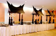 the buffet table is set up with many different types of food on top of it