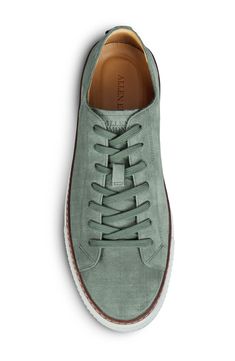 Sleek and sporty, this versatile leather sneaker features minimal detailing and a classic lace-to-toe profile with a rubber sole brightly grounding every step. Lace-up style Removable insole Leather upper, lining and sole Imported Modern Custom Sneakers With Rubber Sole For Spring, Spring Sneakers With Textured Sole, Modern Low-top Sneakers For Derby, Modern Leather Sole Sneakers For Spring, Modern Spring Sneakers With Leather Sole, Sporty Plain Toe Sneakers For Spring, Modern Lace-up Custom Sneakers For Spring, Classic Low-top Sneakers For Derby, Classic Low-top Sneakers For Casual Wear