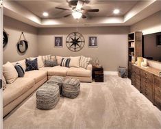 a living room filled with furniture and a flat screen tv