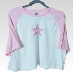 This Pink And White Graphic T-Shirt In Womens Plus Size 4xl Is New With Tags! This Cropped Crew Neck Short Sleeve Top Features A Front Graphic Logo Displaying A Pink Hollowed Out Star. A Great Addition To Your On The Go T-Shirt Collection. Features A Baseball Style Cut With Short Raglan Sleeves. Top Is Made Of A Stretch Knit And Oversized For Added Comfort... *Measurements & Details: Bust/Chest (Ptp): 25" Length: 19" Color: Pink/White Material: 95% Polyester / 5% Spandex *Measurements Are Approx Cheap Heart Print Relaxed Fit T-shirt, Casual Relaxed Fit Tops With Star Print, Star Print Relaxed Fit Top For Loungewear, Relaxed Fit Star Print Top For Loungewear, Crew Neck Tops With Star Logo For Summer, Casual Star Print Tops For Loungewear, Pink Crew Neck Top With Star Print, Pink Star Print Crew Neck T-shirt, Pink Crew Neck T-shirt With Star Print