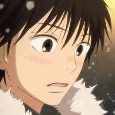 an anime character with black hair and white fur on his shoulders looking at the camera