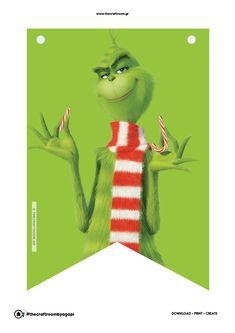 the grinch is holding two candy canes in his hand and wearing a striped sweater