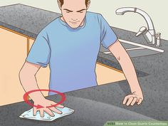 a man wiping his hands with a cloth in front of a sink and faucet