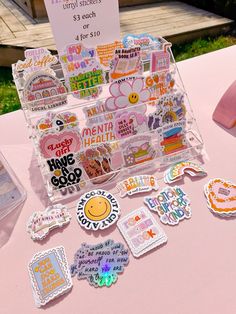 there are many stickers on the table