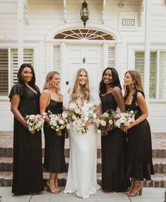 bride and her bridesmaids in black dresses