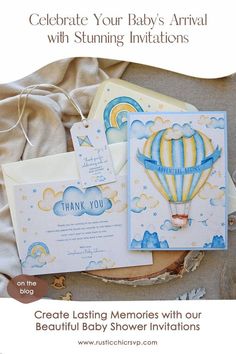 some cards and envelopes are laying on a bed with the words, celebrate your baby's arrival with stunning illustrations