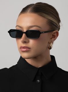 The square sunglasses are a bold fusion of modern elegance and vintage flair. With their sharp, clean lines and oversized silhouette, they command attention, framing the face with geometric precision. PRODUCT DETAILS Frame Shape: Rectangle Frame Color: Black Lens Color: Smoke, Lens Category 3 100% UV Protection Comes with a Protective Vegan Pouch SIZE MM INCHES FRAME WIDTH 138MM 5.4" FRAME HEIGHT 35.9MM 1.4" NOSE GAP 21MM 0.8" Sunglasses For Round Face, Elegant Sunglasses, Rectangle Frame, Rectangular Sunglasses, Rectangle Sunglasses, Black Sunglasses, Uv Protection, Personal Style, Gap