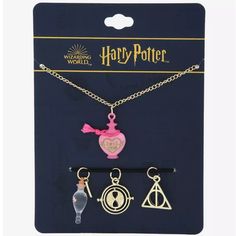 harry potter necklaces and keychain set with charms in the shape of hogwart's house