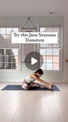 a woman sitting on top of a yoga mat