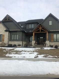 a large house with snow on the ground