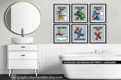 bathroom scene with bathtub, sink and four framed cartoon characters on the wall above it