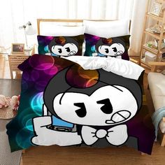 a bed with a cartoon character on the comforter and pillow cases in front of it