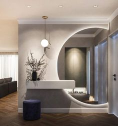 a modern bathroom with an oval mirror above the sink