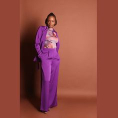 Elevate your style with our Violet Women's Purple Pants Suit - a chic and sophisticated ensemble that exudes timeless elegance. This suit features a tailored, belted design, with a stunning gold belt buckle and opulent gold buttons that add a touch of luxury to your look. Suit includes jacket, pants and belt. Elegant Tailored Wide-leg Pants Sets, Luxury High-waisted Office Pants, Elegant Formal Blazer With Belt, Elegant Fitted Blazer With Belt Detail, Elegant Blazer With Belt Detail For Work, Elegant Workwear Blazer With Belt Detail, Chic Formal Blazer With Belt Detail, Chic Formal Set With High-waisted Pants, Elegant Fall Set With High-waisted Pants