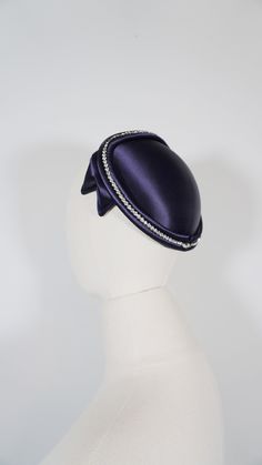 Material: Satin Color: Navy Blue  Label: Styled by Janet The hat is in excellent vintage condition. Beautiful hat. There are faux rhinestones that adorn alone the side. One size fits most. --TERMS AND CONDITIONS: Each item is wrapped in acid free tissue paper to preserve and protect the garment/ item. Items are processed and shipped within 2-3 business days. Your satisfaction is our highest priority. Because of the age of an (vintage) item and previous owner, certain items could have a smoke odor. Each item is inspected for quality and is guaranteed to be in the condition it was listed as. When you buy vintage, you're purchasing history. All major flaws in the condition section, but slight wear and imperfections are to be expected.Final Sale --SHIPPING: USPS Priority Mail is used and deliv Elegant Formal Mini Cap Hat, Elegant Evening Costume Cap, Elegant Evening Cap Hat, Vintage Costume Hat With Pinched Crown For Party, Vintage Cloche Headpieces For Evening, Vintage Adjustable Headpieces For Evening, Adjustable Vintage Headpieces For Evening, Retro Curved Brim Costume Hats For Party, Vintage Party Costume Hat With Structured Crown