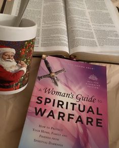 a woman's guide to spiritual warfares with a coffee cup and book