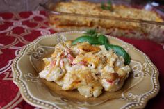 a plate with some food on it and a casserole dish in the background