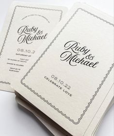 two wedding program booklets on top of each other with the words ruby and michael written in cursive font