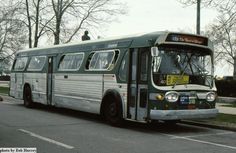 an old bus is parked on the side of the road