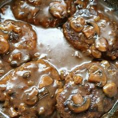 some food is cooking in a skillet on the stove and ready to be eaten