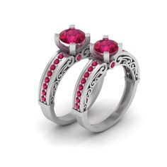 two rings with pink stones on each side