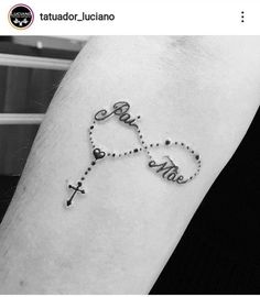 a cross tattoo on the arm with words that spell out love and faith in cursive writing