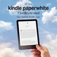 a hand holding an electronic device with the text kindle paperwhite on it