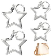 four star shaped cookie cutters and a handbag on a white background with one bag in the foreground