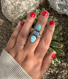 The second of my handmade "ocean wave" ring. The four small circles on the ring were handstamped by me, and look like tiny little ocean waves! The gorgeous Golden Hills turquoise stone on top, an Australian opal doublet in the middle, and Mexican turquoise stone on the bottom, come together to remind us of the cool colors of the ocean. This has a stamped split ring band. This is one stunning ring sure to make a statement! This ring can be sized up a half size. Please send a message via the "cont Island Jewelry, Golden Hill, Wave Ring, Main Menu, Ocean Wave, Australian Opal, Split Ring, Ring Band, Ocean Waves