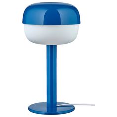 a blue and white lamp on a stand