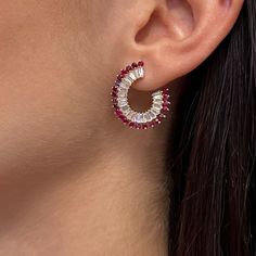 Elevate Your Attire With These Dazzling Hoop Earrings. Crafted In Fine 14k Yellow Gold. These Earrings Feature Prong Set Baguette Cut Diamonds Weighing 2.06 Carats With Round Cut Rubies Weighing 1.89 Carats. Diamond Quality: Color G-H And Clarity Si. Secured With Pushback Closure. Earring Length: 1 Inch. Width: 6.4 Mm. Total Weight: 6.08 Grams. The Earrings Come With A Presentable Gift Box. Id: 02093 White Small Hoop Earrings With Halo Design, Red Elegant Round Hoop Earrings, Elegant Red Round Hoop Earrings, Elegant Red Hoop Earrings For Formal Occasions, Red Hoop Jewelry For Wedding, Elegant Red Hoop Jewelry, Red Single Earring Fine Jewelry, Red Hoop Jewelry For Formal Occasions, Modern Red Hoop Earrings